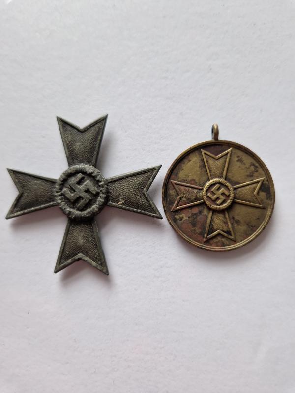 Two damaged War Merits